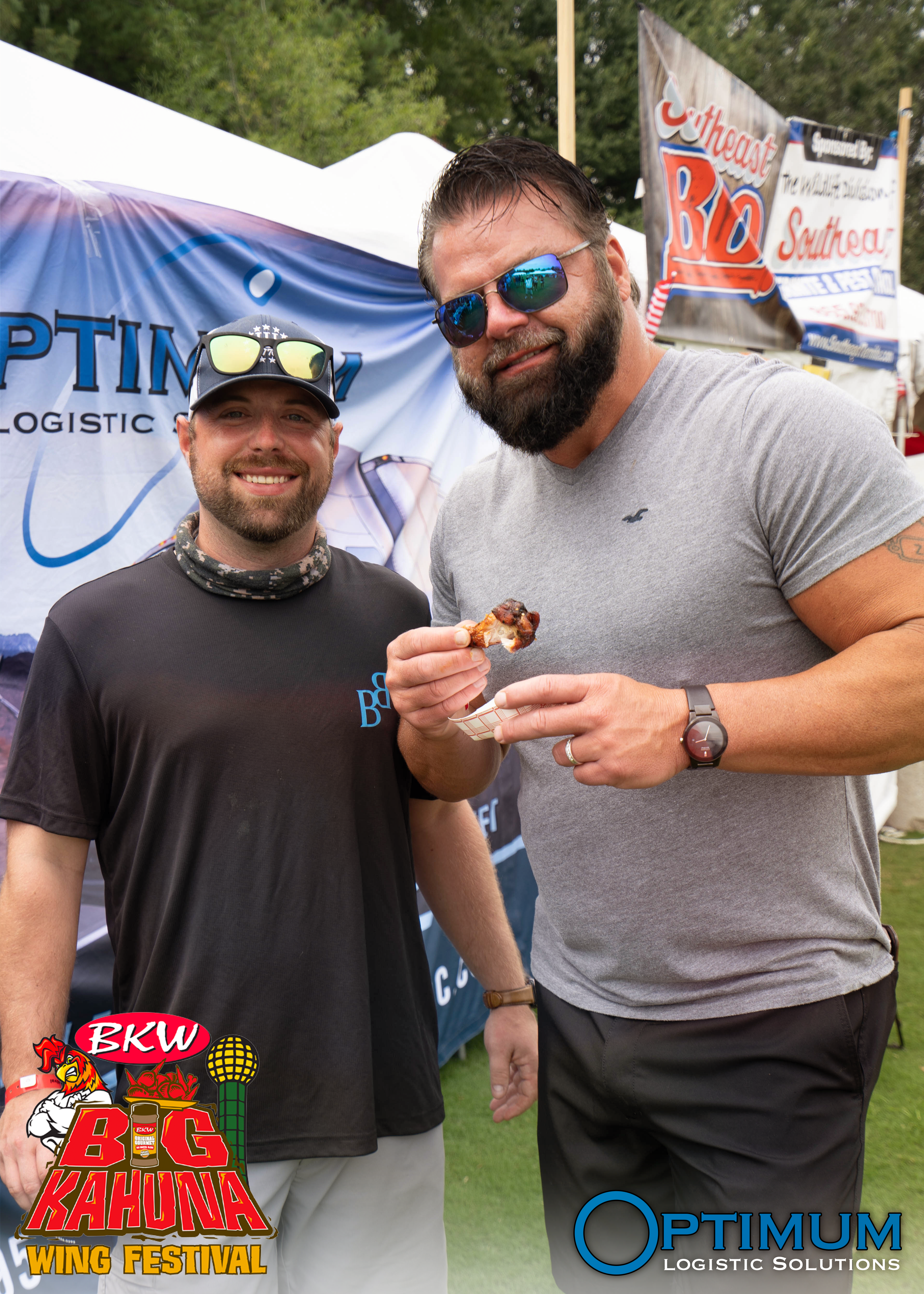 Chris and Rick enjoying a chicken wing at the Big Kahuna Wing Festival Fundraiser